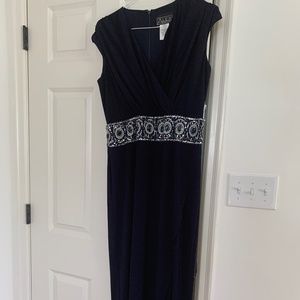 Navy full length dress with perfect high jeweled waistband .  Small cap sleeves.